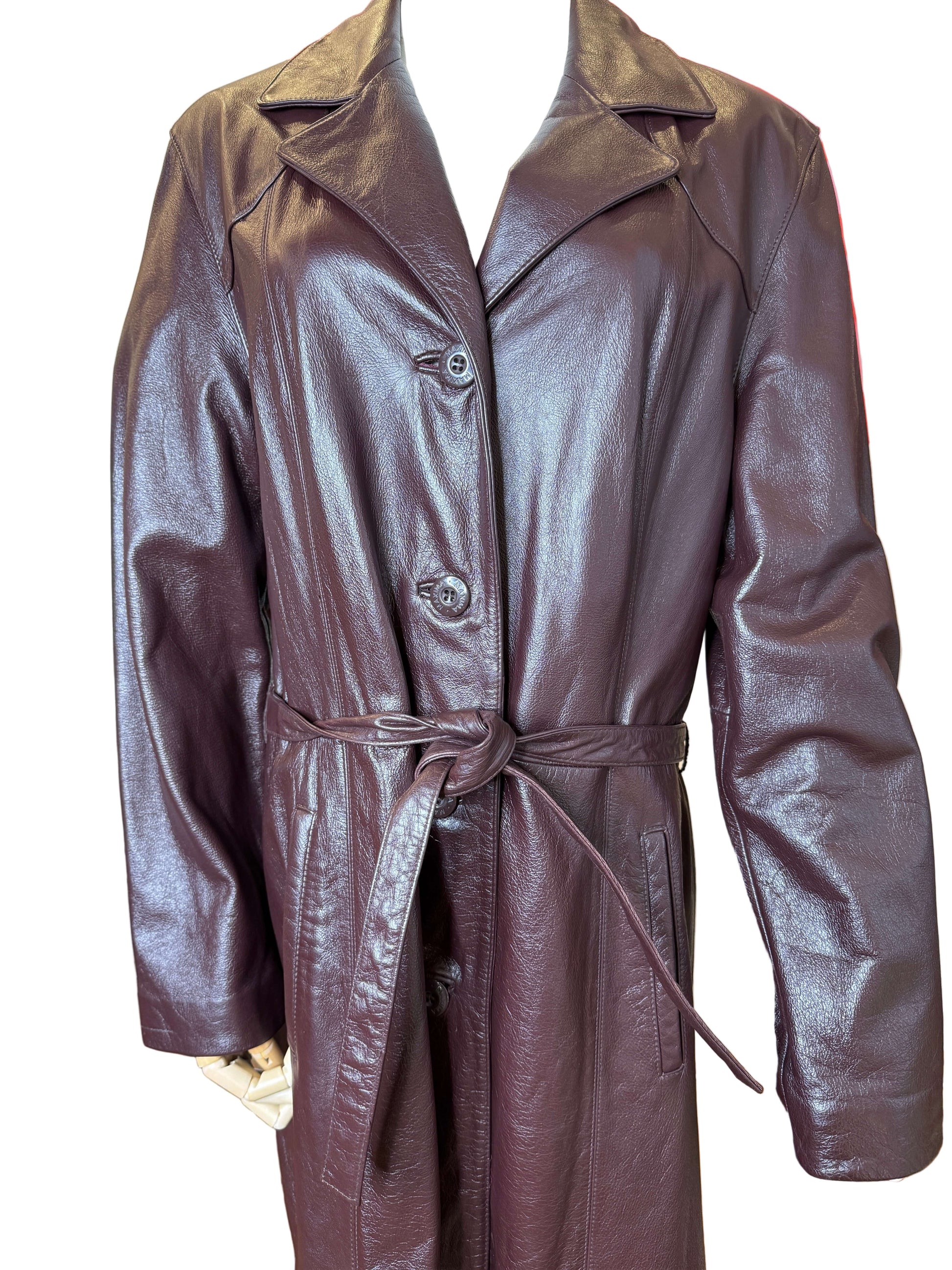 Vintage 1990s wilsons leather trench coat in deep burgundy and brown with original belt and buttons.